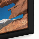 Black wall art featuring a textured depiction of Colorado Springs, with vibrant colors on a framed canvas.