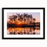 Extra large abstract art print of the Everglades in vibrant colors on a textured canvas, framed in black.