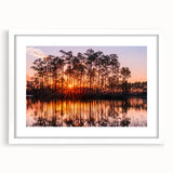 Abstract art print of Everglades scenery in muted green and blue tones, framed in white, suitable for dining room decor.