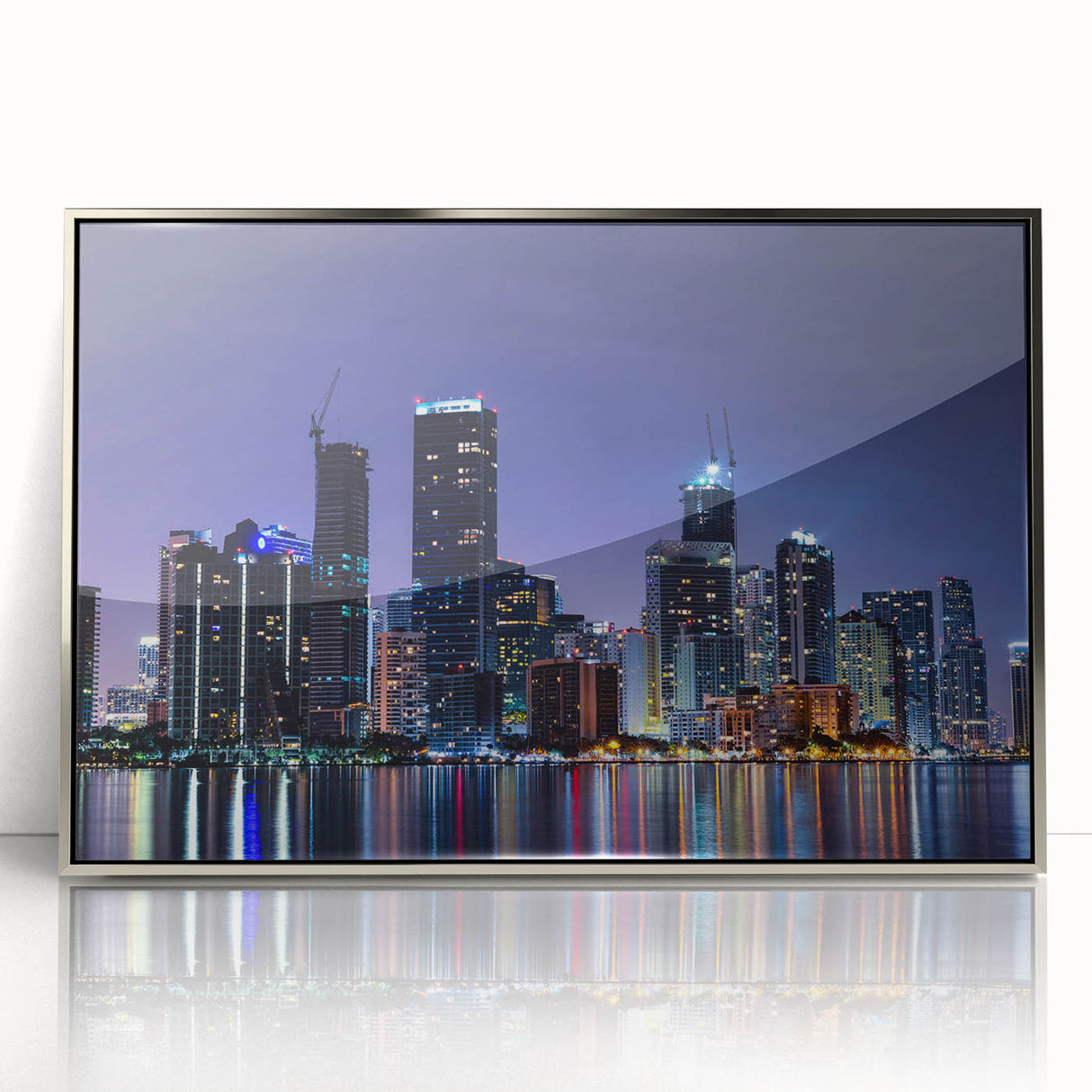 Mid-century modernist art depicting Miami skyline in pastel shades on a silver-framed acrylic print.