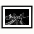 Abstract art print of Atlanta skyline in vibrant colors on a large framed canvas, suitable for living room decor.
