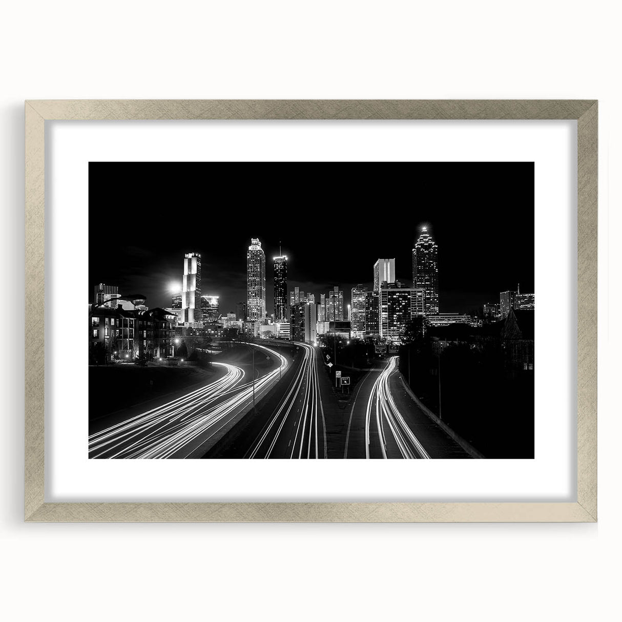 Textured abstract art print of Atlanta skyline in muted gray and blue tones on a framed silver canvas.