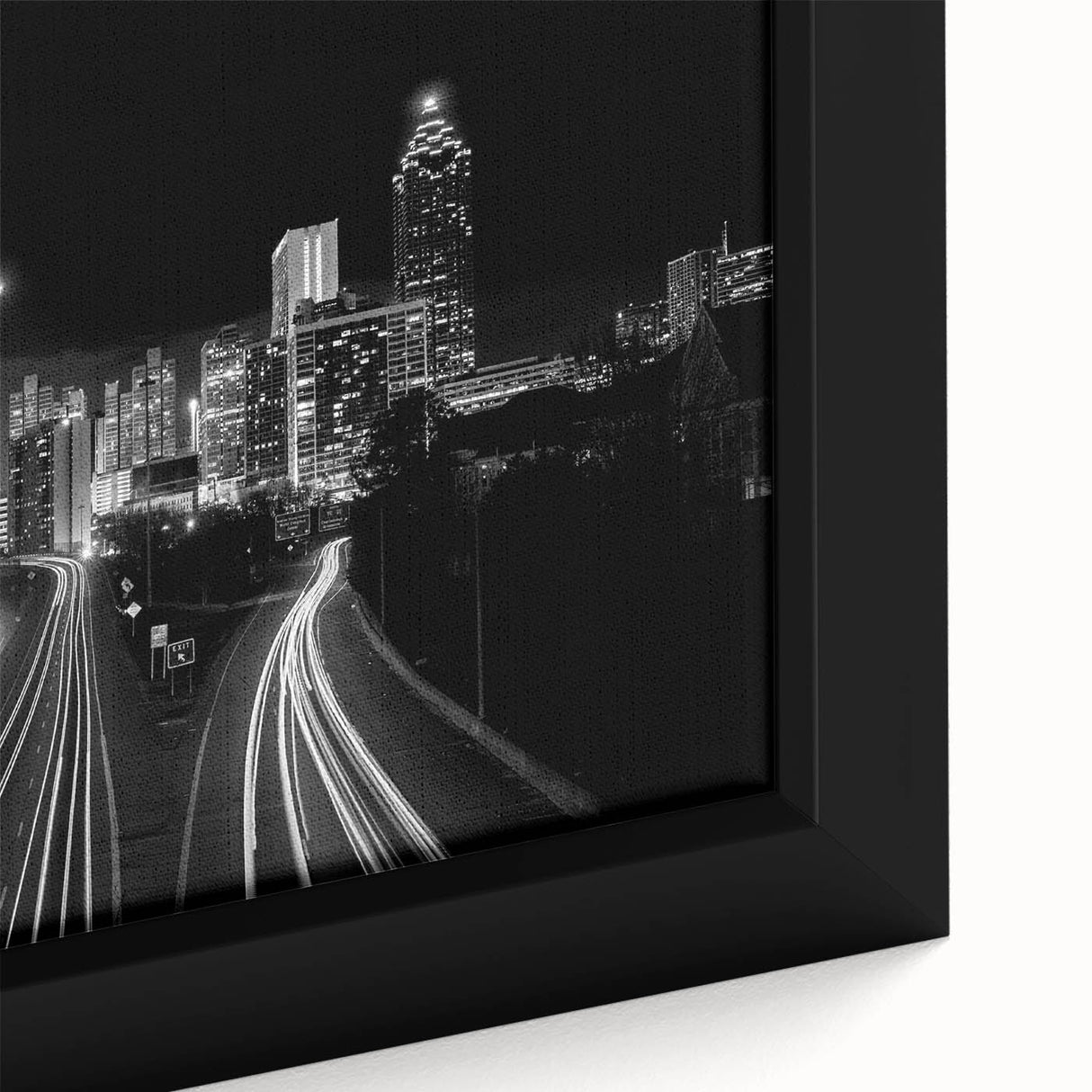 Framed canvas of Atlanta skyline in textured black with colorful accents, ideal for large living room walls.