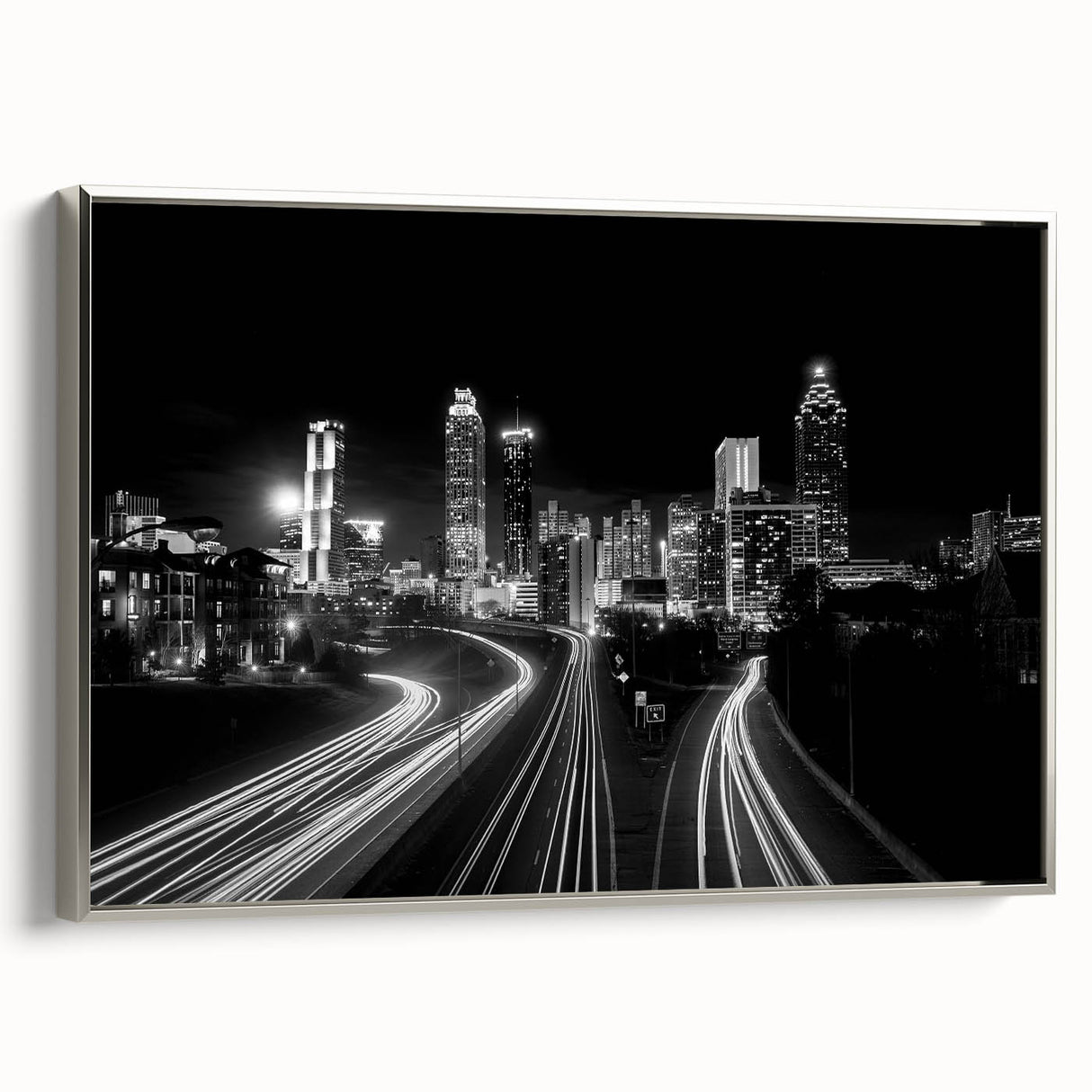 Framed canvas featuring a colorful Atlanta skyline landscape, ideal for enhancing a modern living room decor.
