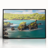 Large abstract wall art depicting a vibrant Maui landscape in mid-century modernist style, framed in black acrylic.