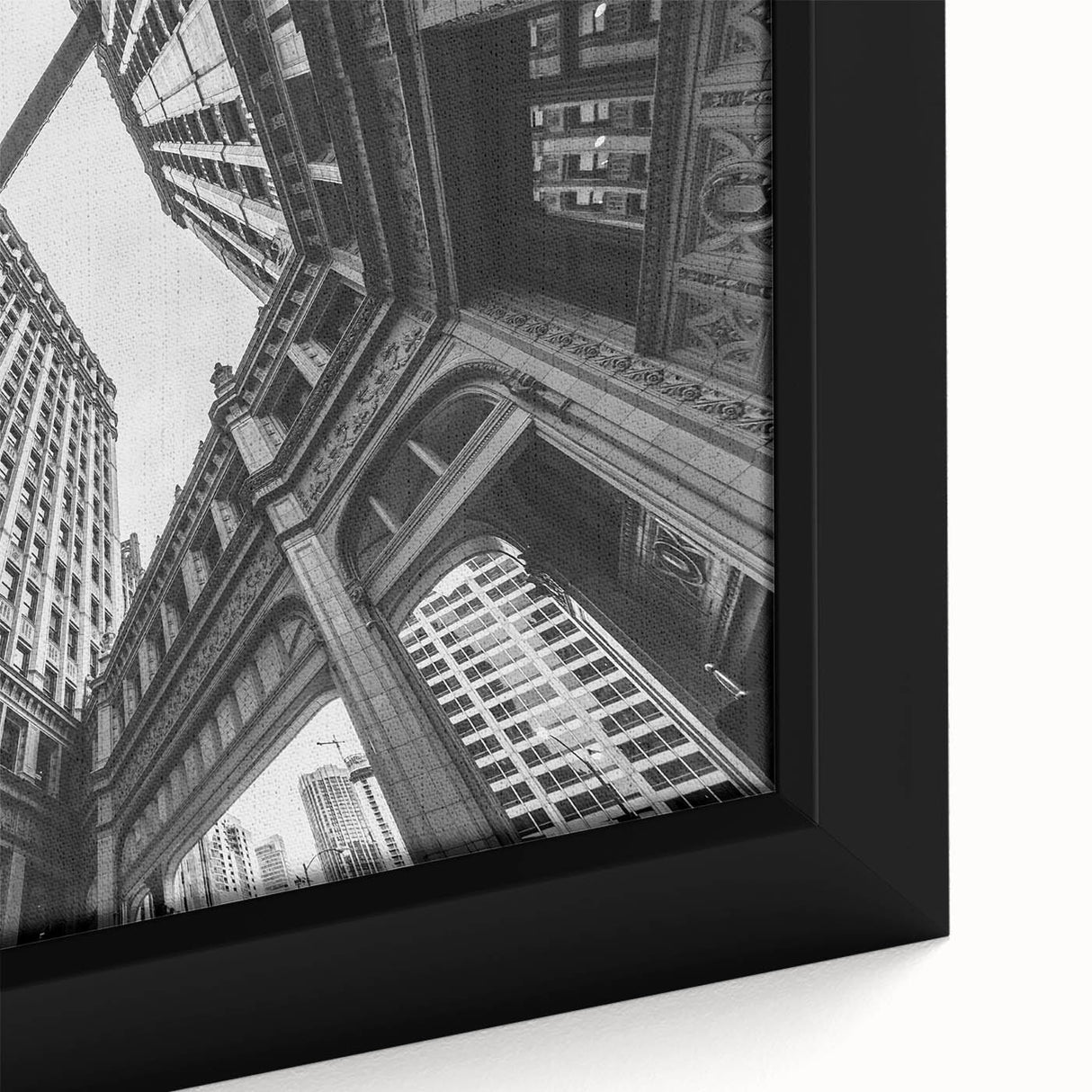 Framed canvas of Chicago skyline in textured black with colorful accents, ideal for living room decor.