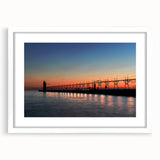 Abstract art print of Lake Michigan with muted blue and gray tones on a framed white mat, suitable for dining room decor.