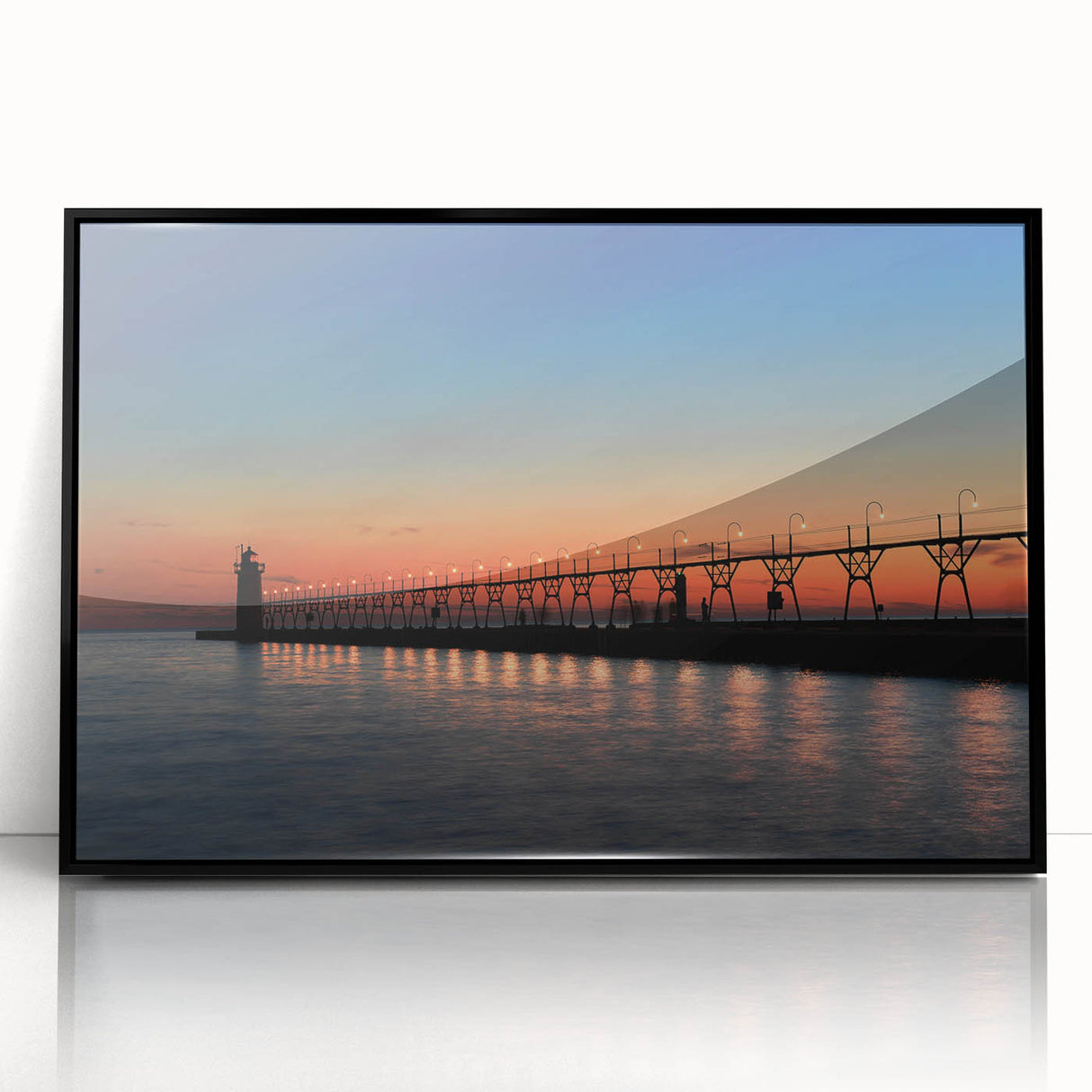 Large abstract wall art of Lake Michigan in muted blues and grays, framed in black acrylic.