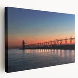 Panoramic view of Lake Michigan at sunset, with muted blue and orange tones on stretched canvas.