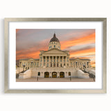 Textured abstract art print depicting Kansas scenery in muted earth tones on a framed silver mat, suitable for bedroom decor.