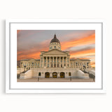 Abstract art print of Kansas scenery in muted earth tones on a framed white mat, suitable for bedroom or dining room decor.