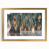 Textured abstract art print of Louisiana scenery in muted earth tones on a framed gold mat, suitable for bedroom decor.