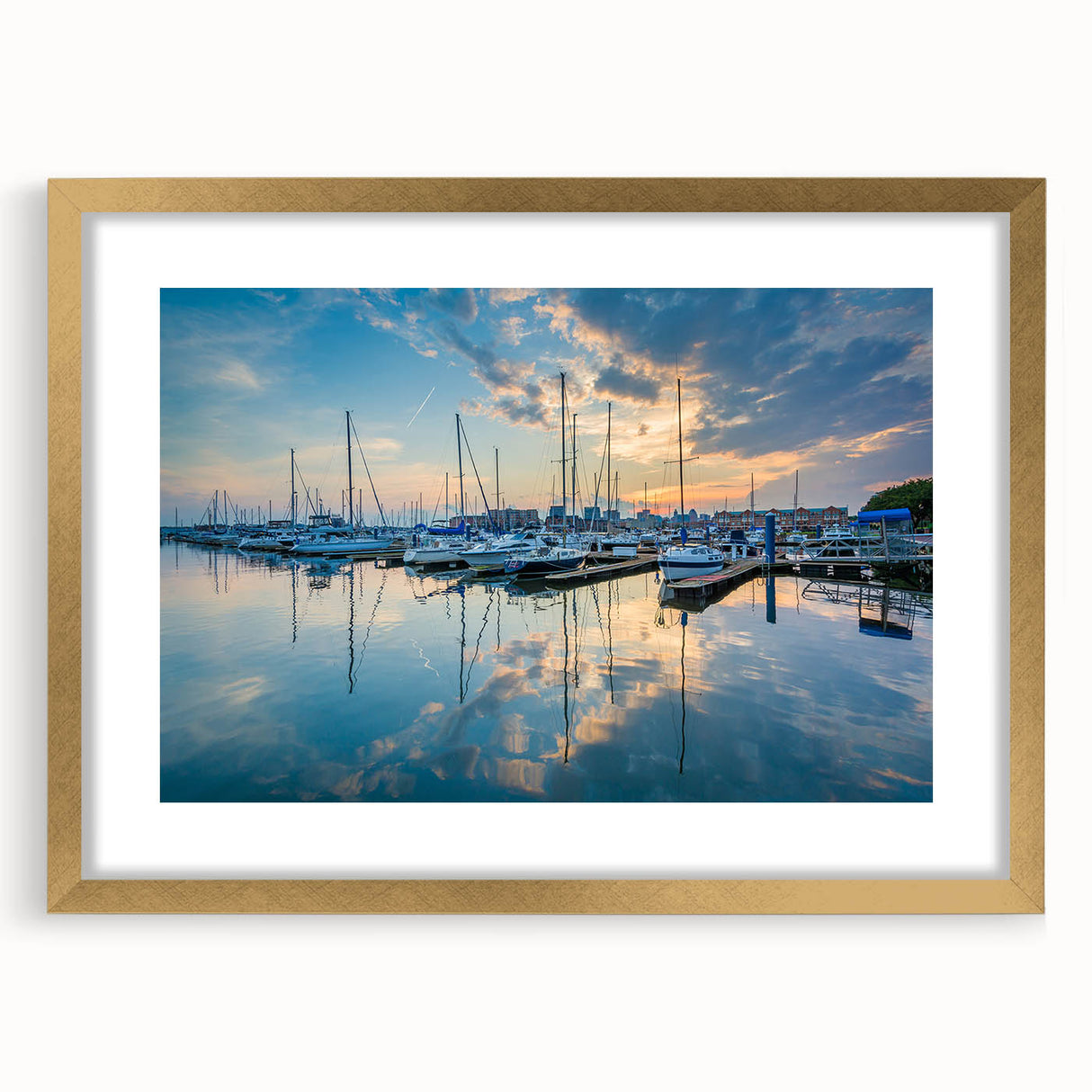 Extra large abstract art print of Baltimore scenery in muted gold and blue tones, framed with a gold mat.