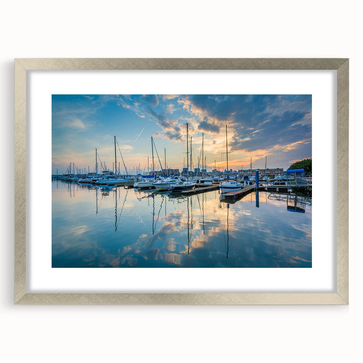 Textured abstract art print of Baltimore skyline in muted gray tones, framed in silver, ideal for bedroom wall decor.