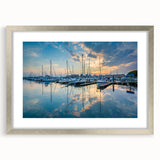 Textured abstract art print of Baltimore skyline in muted gray tones, framed in silver, ideal for bedroom wall decor.