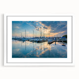 Abstract art print of Baltimore skyline in muted blue and gray tones on a white framed poster.
