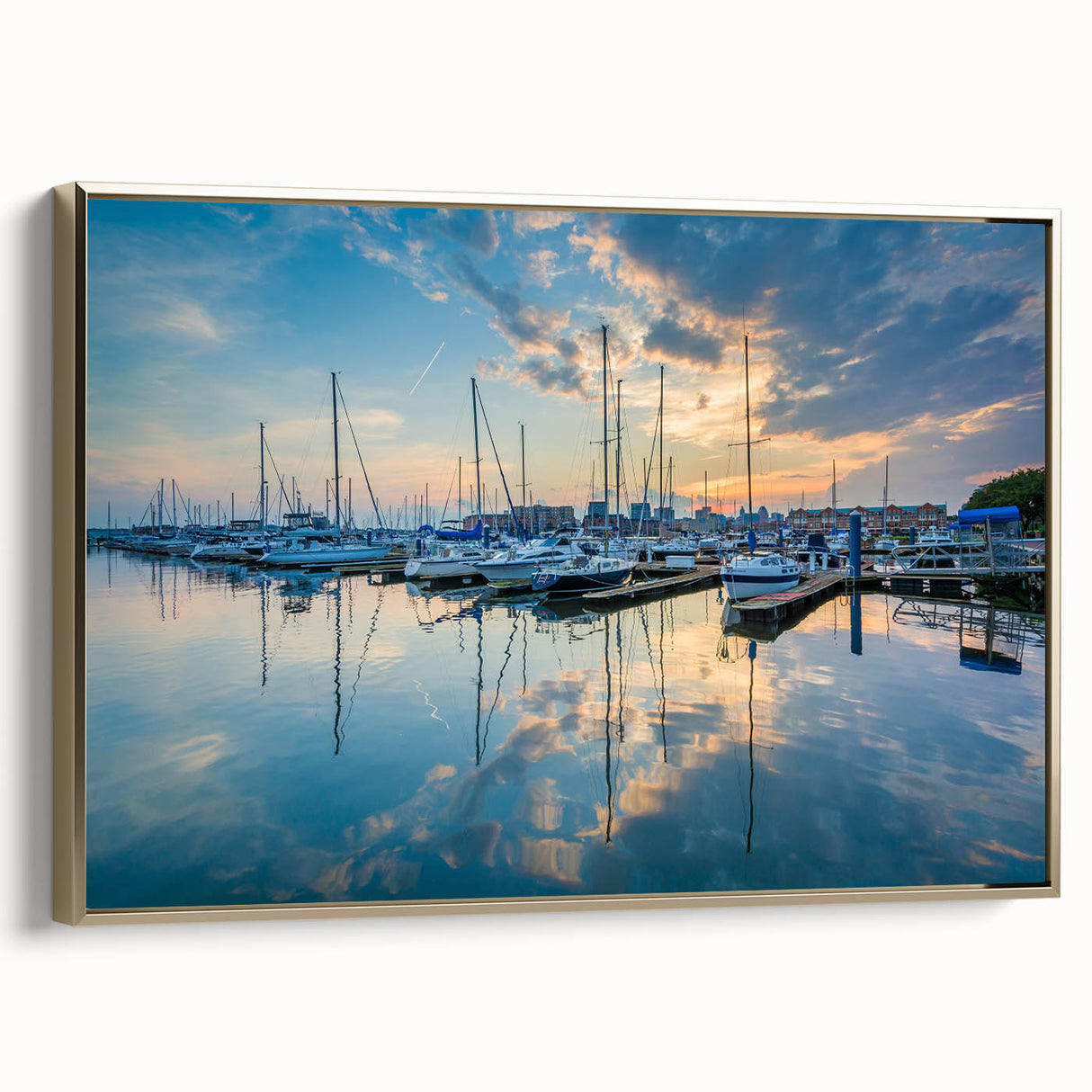 Framed canvas wall art featuring a vintage-style landscape of Baltimore in muted black and gold tones.