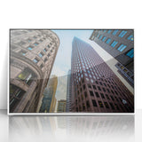 Framed acrylic print of the Boston skyline in art deco style, with muted blue and gray tones.