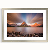 Textured art print of abstract Montana scenery in muted earth tones, framed in silver, ideal for bedroom wall decor.