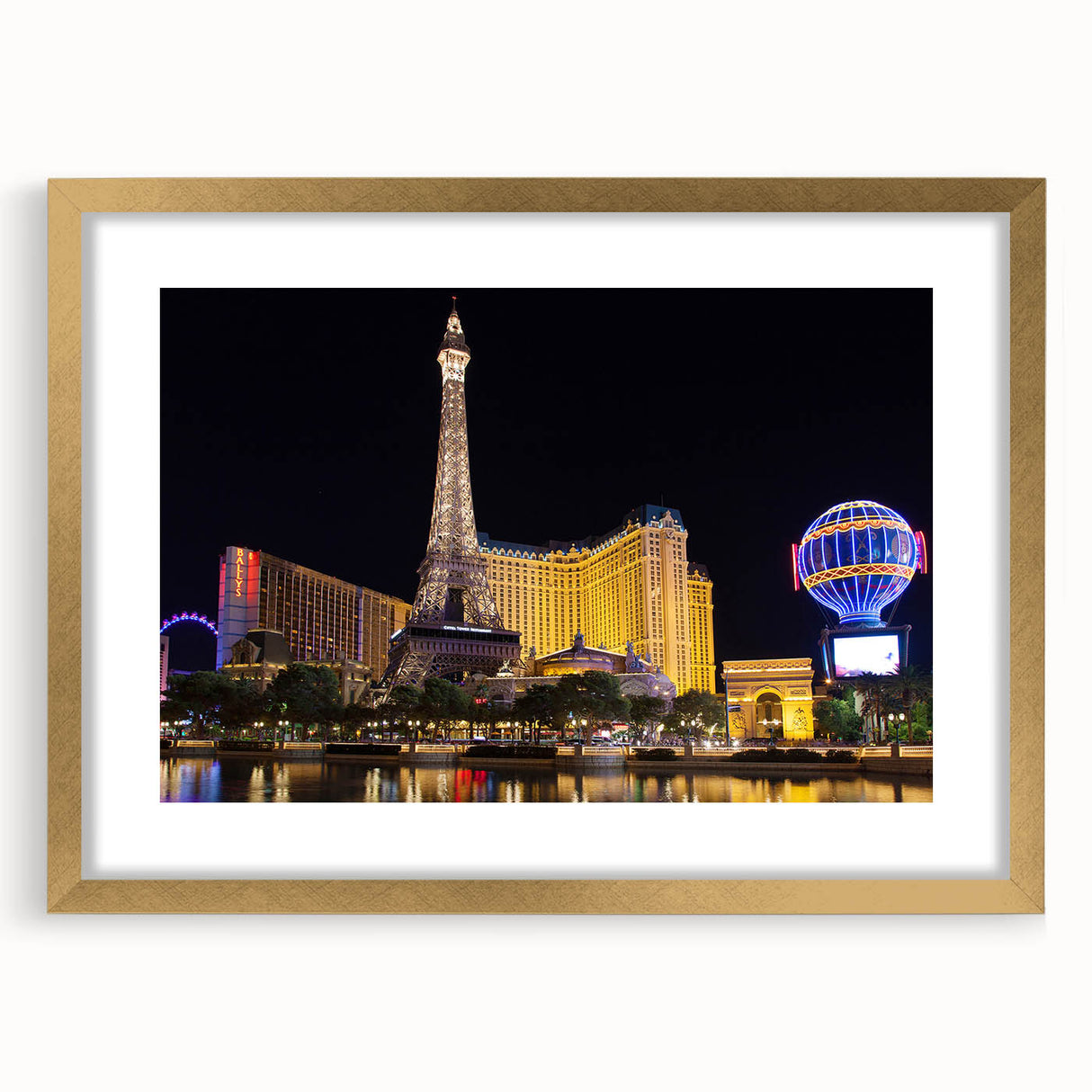 Extra large abstract art print of Las Vegas skyline in vibrant gold and black tones on a framed canvas.