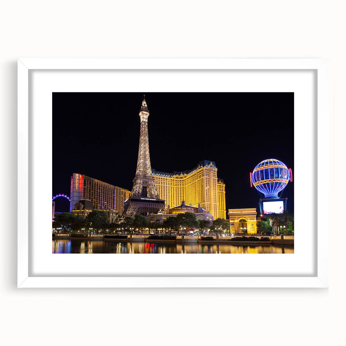 Abstract art print of Las Vegas skyline in muted gray and blue tones on a framed white mat, suitable for dining room decor.