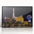 Large abstract wall art depicting the Las Vegas skyline in vibrant colors, framed in black acrylic.