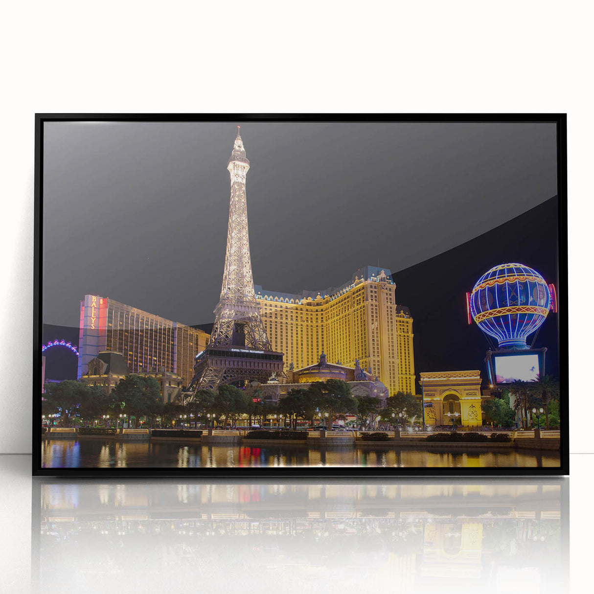 Large abstract wall art depicting the Las Vegas skyline in vibrant colors, framed in black acrylic.