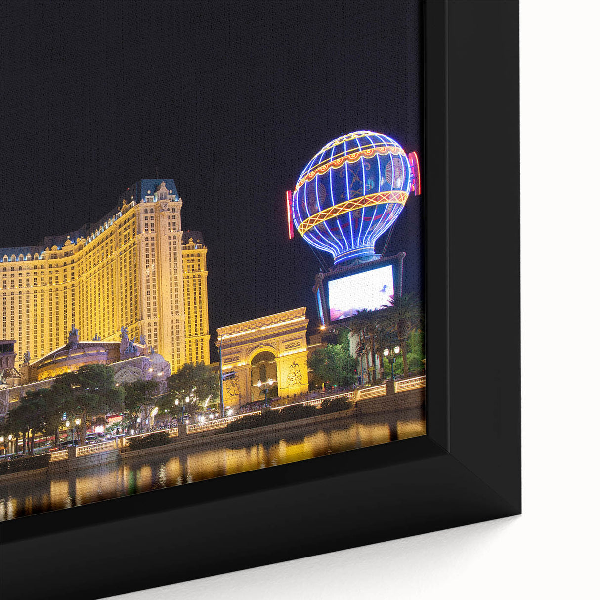 Extra large framed canvas of Las Vegas scenery in black with colorful, textured highlights, suitable for living room decor.