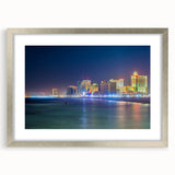 Textured art depicting abstract shapes in cool blue and gray tones on a framed canvas, suitable for bedroom decor.