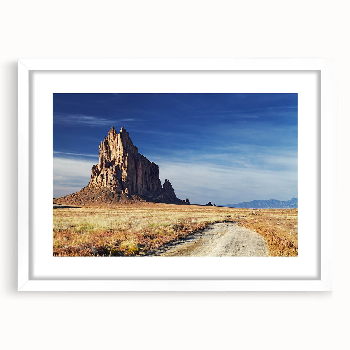 Abstract art print depicting vibrant New Mexico scenery in a white frame, ideal for dining room decor.