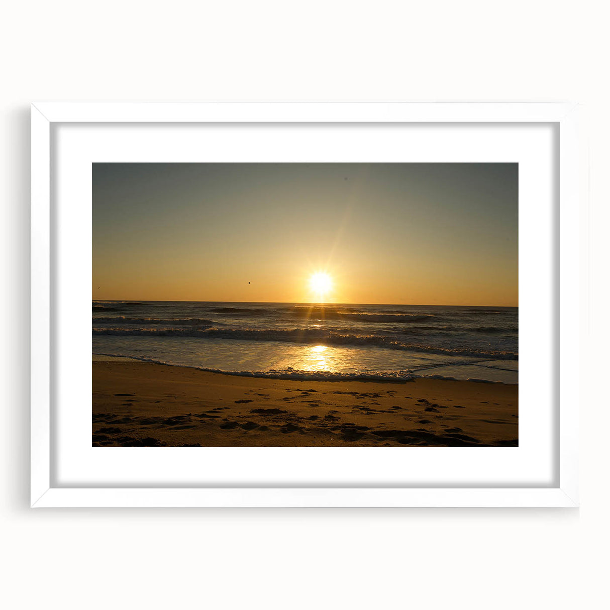 Abstract art print of Cape Hatteras with muted blue and green tones on a white framed canvas, suitable for dining room decor.