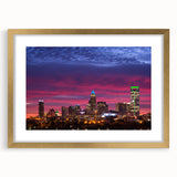Extra large abstract art print of Charlotte skyline in muted gray and blue tones on a textured canvas, framed in gold.