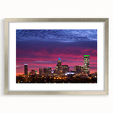 Textured abstract art print of Charlotte skyline in muted blue tones on a framed silver mat, suitable for bedroom decor.