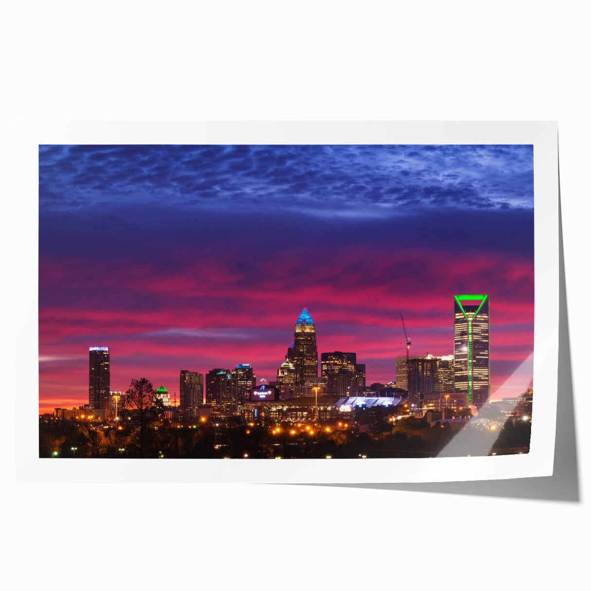 Rolled print of Charlotte, North Carolina skyline in muted gray and blue tones, suitable for dining room wall art.