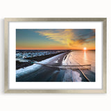 Textured abstract art print of the Outer Banks in muted blue and gray tones, framed in silver, ideal for bedroom wall decor.