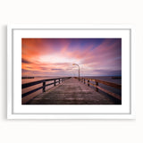 Abstract art print of Long Island scenery in muted blues and greens, framed with a white mat, ideal for dining room decor.