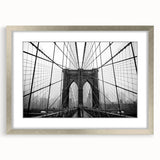 Textured art print of the Brooklyn Bridge in muted gray tones on a framed canvas, ideal for modern bedroom decor.