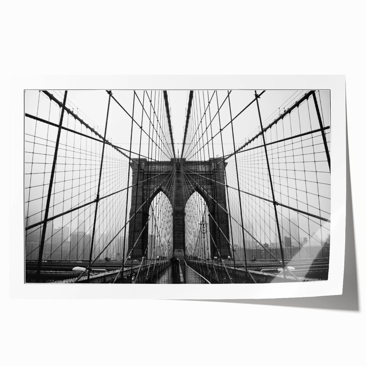 Rolled print of the Brooklyn Bridge in muted gray tones, ideal for art wall dining room placement.