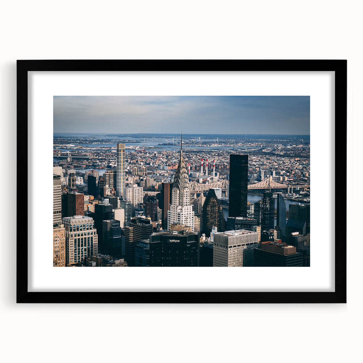 Abstract art print of the Chrysler Building in vibrant, colorful hues on a large, textured canvas.