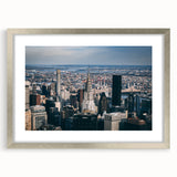 Textured art print of the Chrysler Building in muted gray tones on a framed silver mat, ideal for modern bedroom ambiance.
