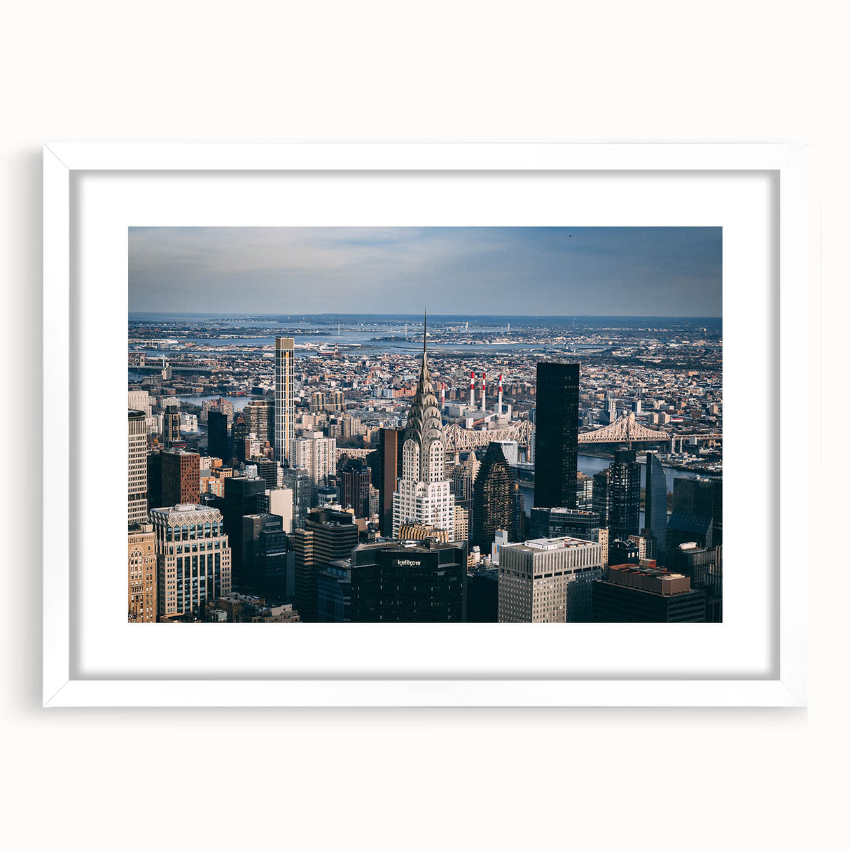 Abstract art print of the Chrysler Building in muted gray and silver tones, framed with a white mat.