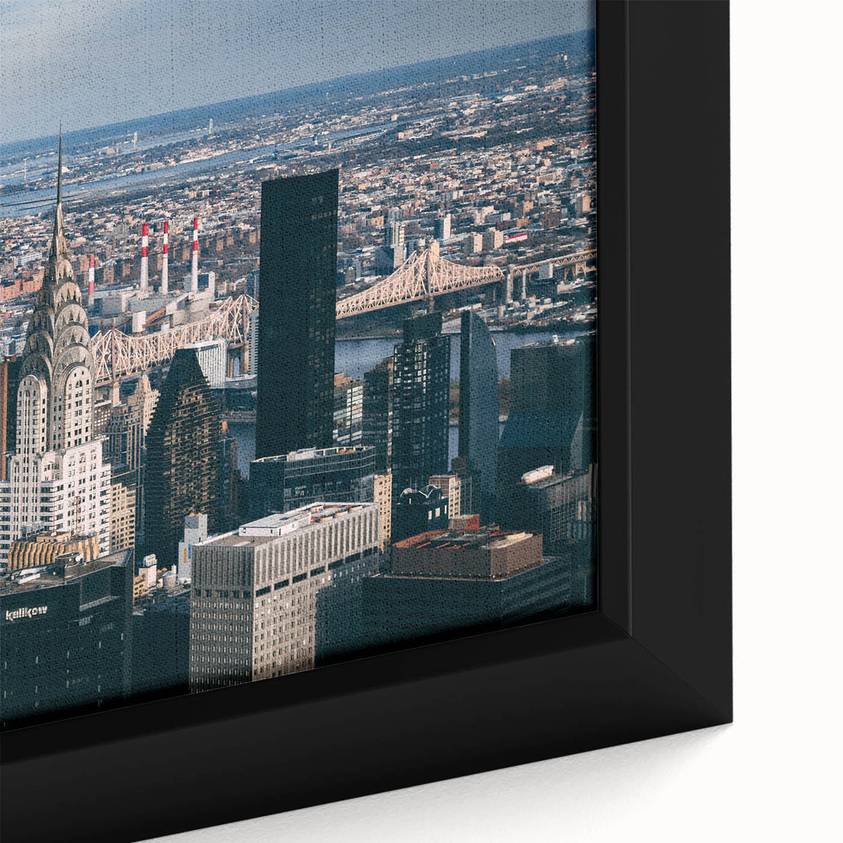 Close-up of a black wall art canvas featuring a textured depiction of the Chrysler Building in vibrant colors.