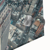 Acrylic print of a large abstract depiction of NYC's Empire State Building in muted gray and blue tones.