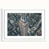 Abstract art print of NYC skyline in muted gray and blue tones, framed with a white mat, ideal for dining room decor.