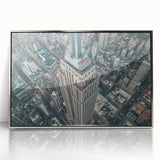 Mid-century modernist art depicting the NYC Empire State Building in muted silver and gray tones on a framed acrylic print.