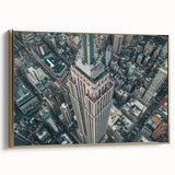 Framed canvas wall art featuring a vintage-style New York City skyline in black and gold tones, ideal for bedroom decor.