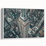 Vintage poster art of NYC Empire State Building in colorful tones on extra large framed canvas, ideal for living room decor.