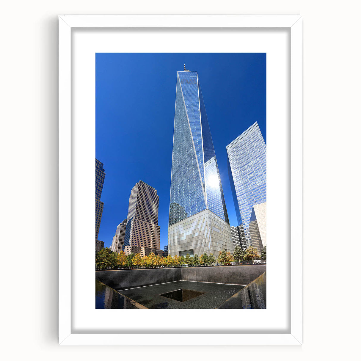 Abstract art print of NYC skyline in muted gray and blue tones on a framed white mat, ideal for bedroom or dining room decor.