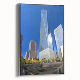 Framed canvas featuring a vintage-style New York City skyline in black with colorful accents, ideal for office decor.