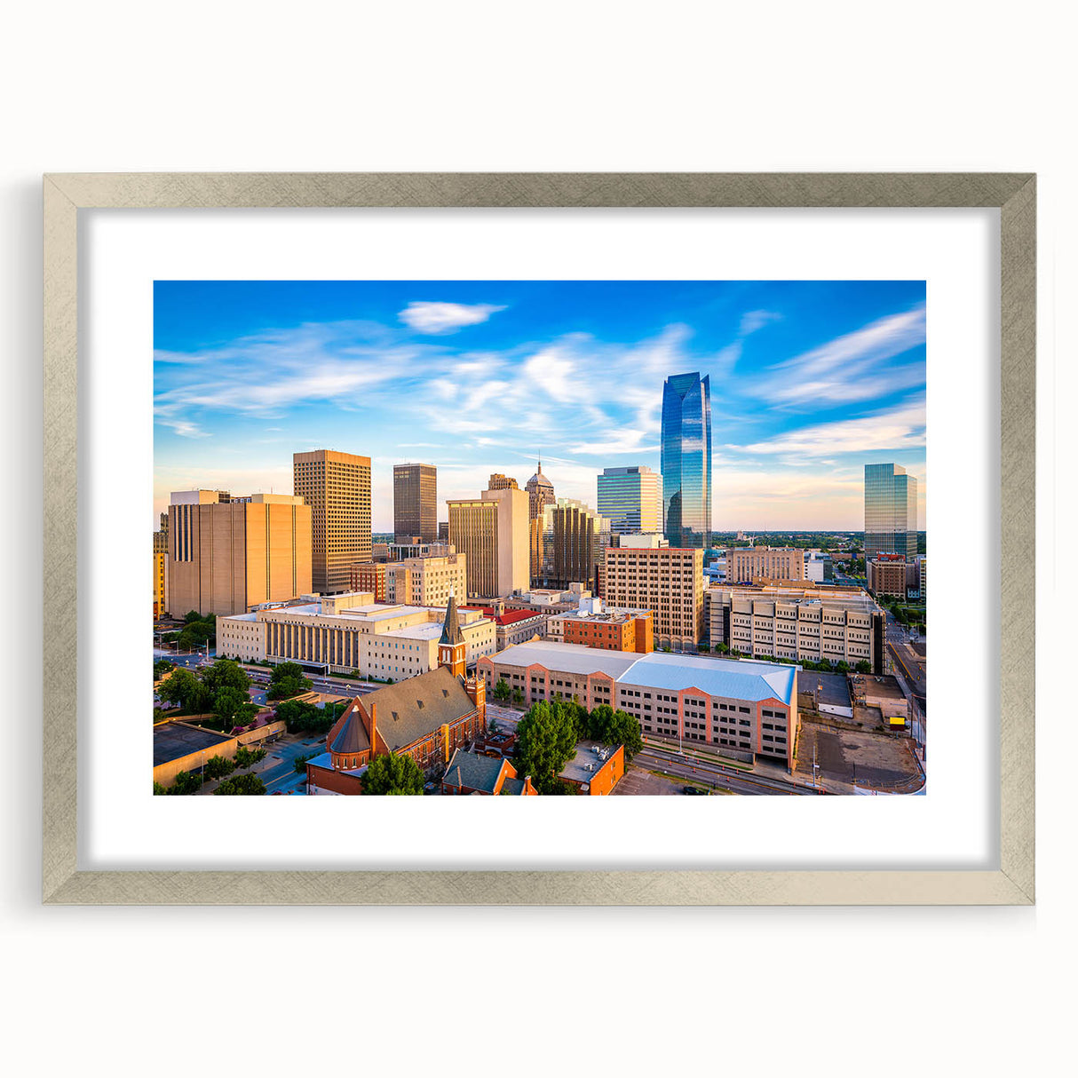 Textured abstract art print of Oklahoma scenery in muted earth tones, framed in silver, ideal for bedroom decor.